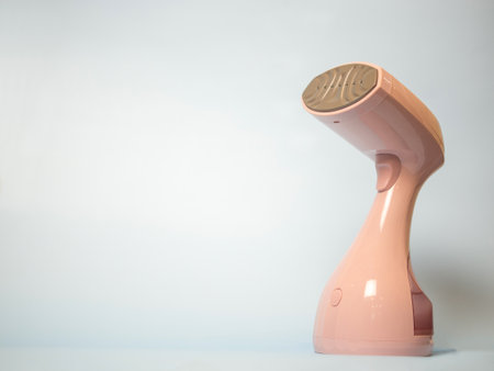 modern handheld clothes steamer with space for text