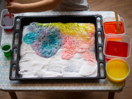 a child makes experiments with chemicals. experiments with soda and citric acid