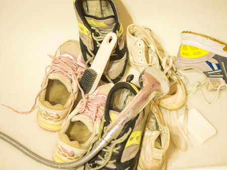 Moscow Russia 06.08.20223 man washes sneakers with a brushの写真素材