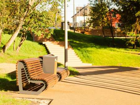 modern wooden city park on the river bank surrounded by forestの写真素材