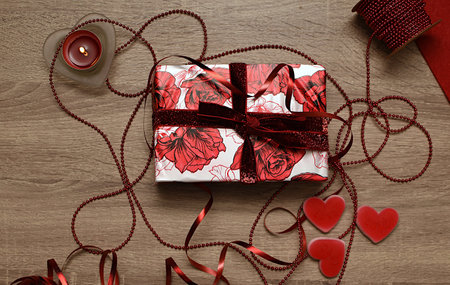 White letter, candle, gift box and heart shaped candies. Gift for loversの写真素材