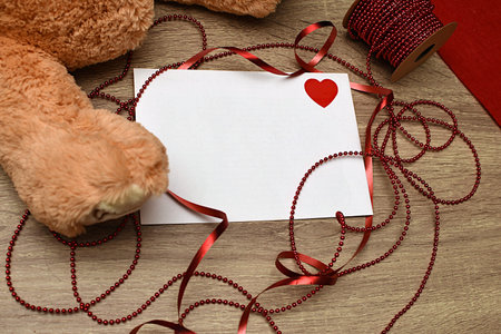 White letter, ribbon and heart shaped candies. Gift for loversの写真素材