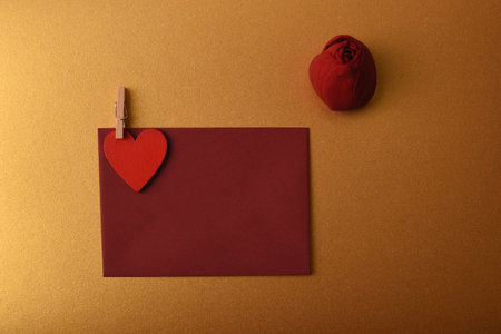 Envelope, red rosebud and heart. Symbol of love and romanceの写真素材