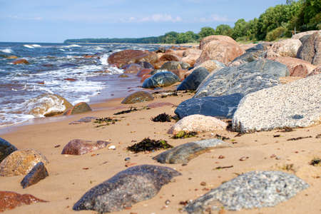 There are many big stones on the coast. Beach in Latvia, Tuya.の写真素材