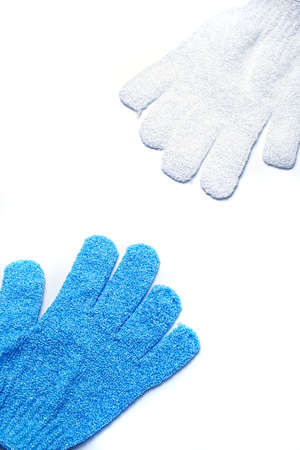 White and blue microfiber sponge-peeling glove. Isolate.の写真素材