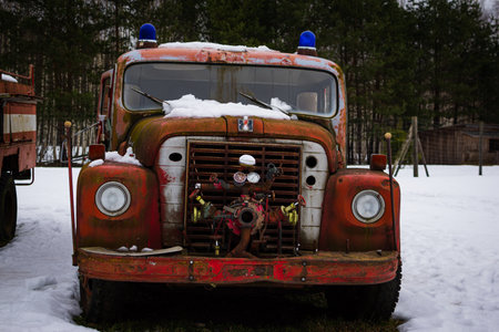 Kekava, Latvia - February 13, 2022: Close-up of an old, rusty, and non-working fire truck.のeditorial素材