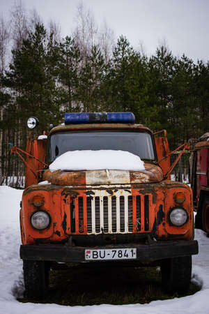 Kekava, Latvia - February 13, 2022: Close-up of an old, rusty, and non-working fire truck.のeditorial素材