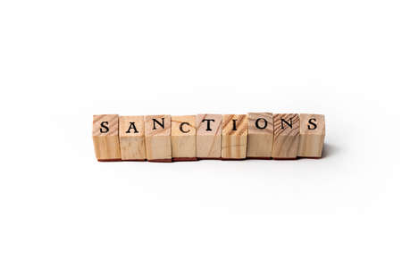 Isolate of wooden letters folded into the word sanctions.の写真素材