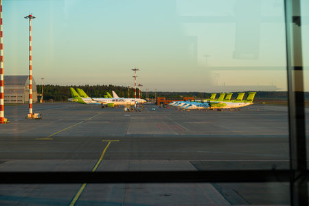Latvia, Riga - 23.05.2022, View from the window of the Riga airport on the planes of AirBaltic.のeditorial素材