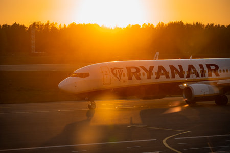 Latvia, Riga - 23.05.2022, The nose of a Ryanair airplane after landing on the runway at the Riga airport on sunset.のeditorial素材