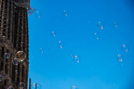 Soap Bubbles In Focus Against A Blue Sky In Barcelona, Spain. copyspace.の写真素材
