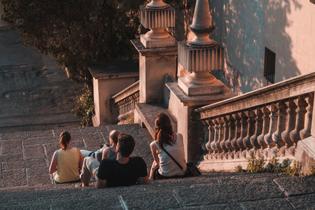 Barcelona, Spain - May 28 2022: People are sitting on the steps of the National Art Museum of Catalonia, waiting for the performance of The Singing Magic Fountain Of Montjuic.のeditorial素材