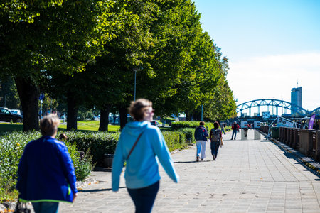 Riga, Latvia - 09 10 2022: People Walk Along The Promenade Along The Daugava.のeditorial素材
