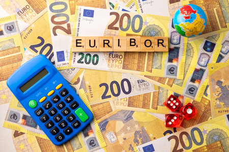 Word EURIBOR Is Written In Wooden Letters On Background Of 200 Euro Banknotes, Globe, Calculator And Dice. Copy paste.の写真素材