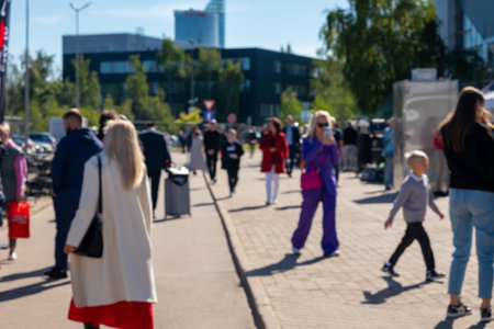 Blurred Shot Of People On Warm Autumn Day In City On Streets Of Riga, Latvia.の写真素材