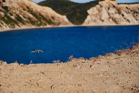Sandy Cliff Of Mountain Is In Focus. Scenic View From Arkoudilas Viewpoint Sandy Beach, Mountains, Ionian Sea Corfu, Greece. Drone Hovered Over Ground To Take Shot Of Scenic Spot.の写真素材