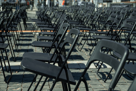 Rows Of Black Plastic Chairs Outside. Holding Event On Summer Day.の写真素材