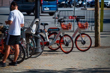 Barcelona, Spain - May 26 2022: Parking for comfortable e-bikes on the street in Barcelona.のeditorial素材