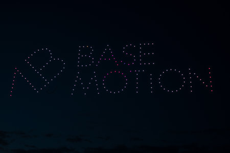Riga, Latvia - 27.04.2023: Baltic Drone Show, Company name in the drone sky - Base Motion.