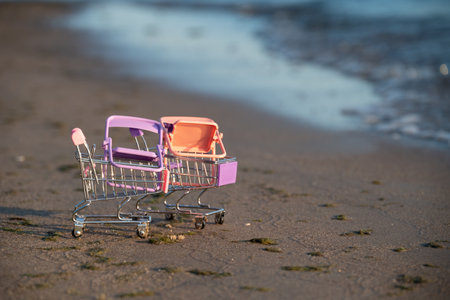 Seascape with two shopping baskets and two chairs. The concept of meditation in nature. Concept from the summer sale with the right things for the beach season.の写真素材