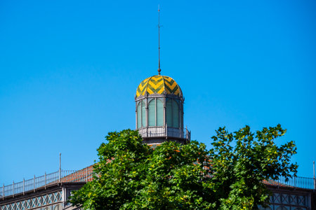 Barcelona, Spain - May 26 2022: The top of the dome with beautiful green and yellow tiles at the Market Museum in the El Born district.のeditorial素材