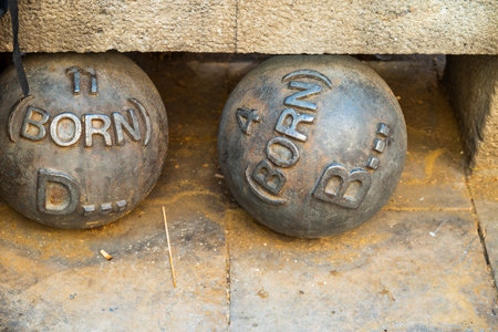 Barcelona, Spain - May 26 2022: Sculpture on la rambla in the form of weights with inscriptions.のeditorial素材