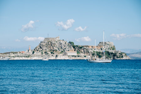 Kerkyra, Greece - 09 24 2022: View of the Old Fortress in Kerkyra, Corfu, Greece. In the foreground...