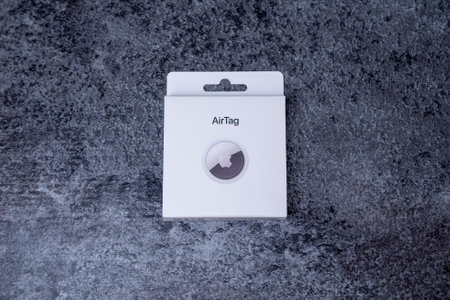 Jurmala, Latvia - 21 09 2023: On table AirTag Apple - gadget to track of your stuff. Air Tag lies on the white box.のeditorial素材