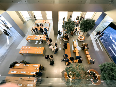 Barselona, Spain - 13.01.2024: Top view of the ground floor space in the Apple Store where people try and choose new Apple products.のeditorial素材