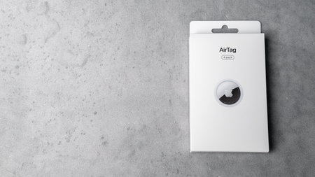 Jurmala, Latvia 25.06.2024: On a light grey background is a white box from Apples 4 Airtag. Copy spaceのeditorial素材