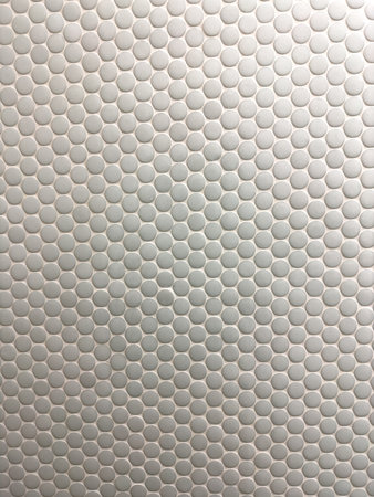 Textured White Hexagonal Tile Pattern Creates a Modern Look for Bathrooms or Kitchens in Residential...