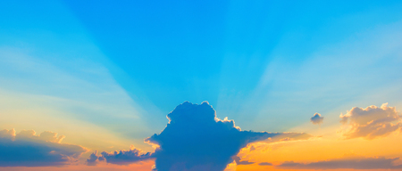 Photo of a beautiful blue sky with clouds at sunsetの写真素材