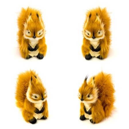 Set of an orange statuettes of a squirrels isolated on a white backgroundの写真素材