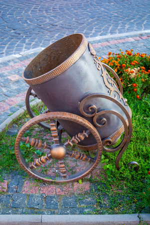 Photo of stylized trash bin like old ancient cannonの写真素材