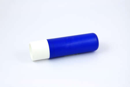 Blue tube of lip balm isolated on white backgroundの写真素材