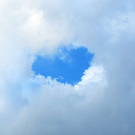 Heart shaped cloud in the blue sky 