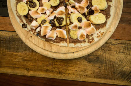 Dessert pizza with chocolate banana and marshmallow 