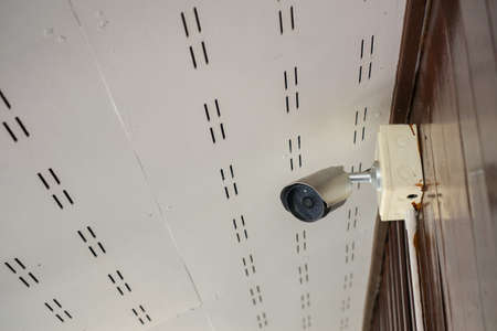 Security CCTV camera at wall in the home.