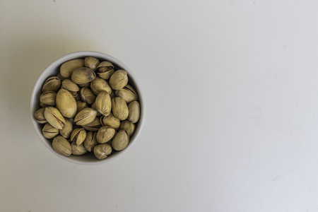 Bowl with Bronte's Pistachio seasoned isolated on a white backgroundの写真素材