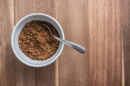 Brown sugar cane on a wooden background with copy spaceの写真素材
