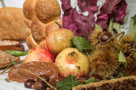 Autumn background with fruits, chestnuts, pomegranatesの写真素材