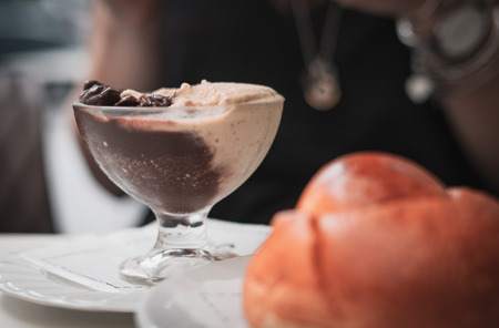 pistachio and chocolate Granita and brioche on a sicilian bar tableの写真素材