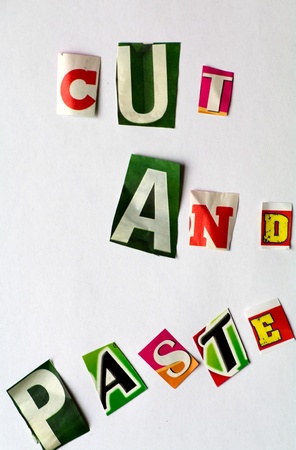 Cut and paste illustrated with letters cut from different newspapersの写真素材