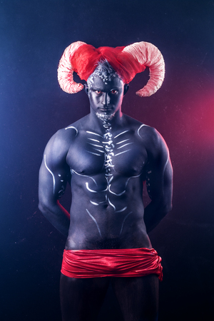 Fiery demon. A terrible demon with hornsの写真素材