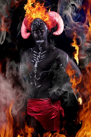 Fiery demon. A burning demon with horns in fire and smoke.の写真素材