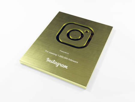 Gold Instagram award with gold body for 1000k followers like Gold play button in side viewのeditorial素材