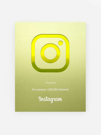 Gold Instagram award with gold body for 1000k followers like Gold play button in front viewのeditorial素材