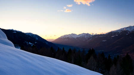Valtellina valley at the sunset with Monte Spluga and Cima del Desenigo in backgroundの写真素材
