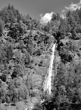 B&W picture of the waterfall of the Valbrutta creekの写真素材