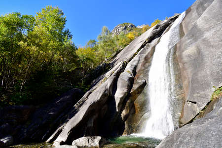 The falls are called Cascate del Ferro and their action has dig chanel and natural slide in the granitic stoneの写真素材